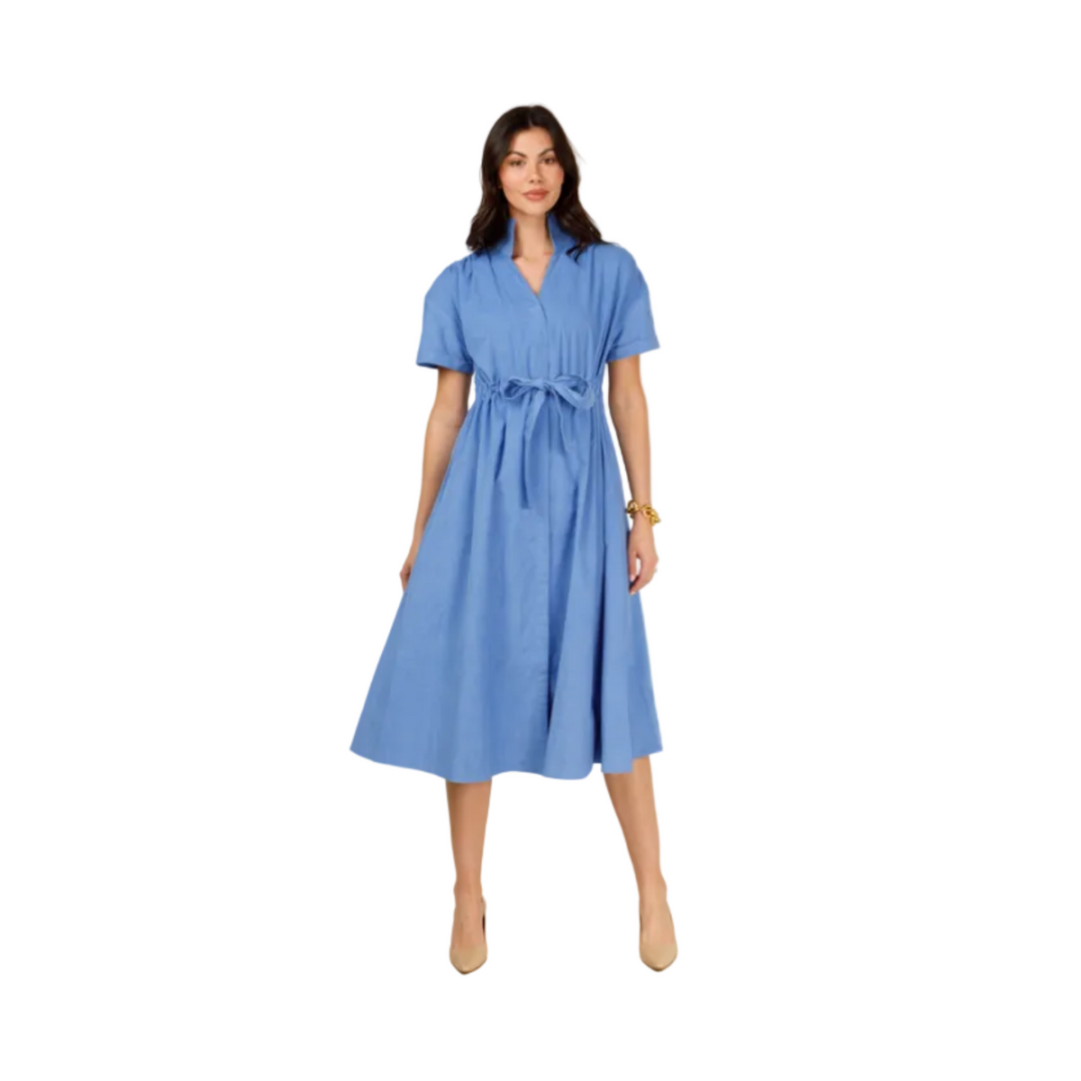 A woman modeling a light blue short-sleeve midi dress with a V-neck, tie waist, and flared skirt, standing against a plain light gray studio background.