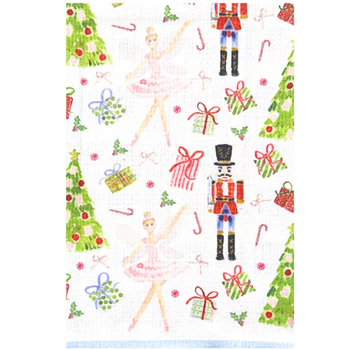 A white fabric item, likely a tea towel or handkerchief, featuring a festive Christmas print with ballerinas, nutcrackers, Christmas trees, candy canes, and wrapped gifts.