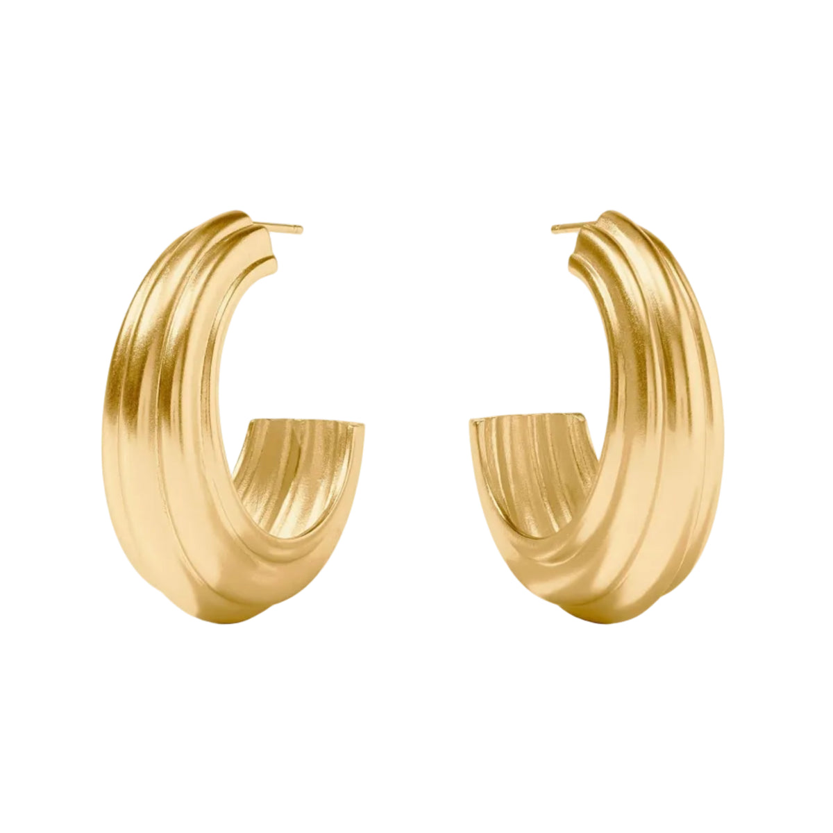 A pair of textured gold huggie hoop earrings with a ribbed, sculptural design, displayed on a clean white background with soft shadows.