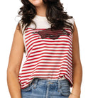 Woman wearing a red and white striped tank top with a graphic design, paired with blue jeans on a white background.