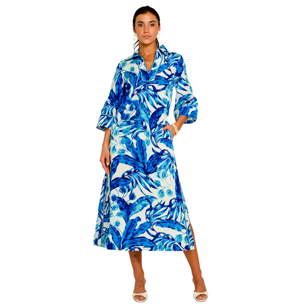 Woman wearing a blue and white patterned dress on a white background