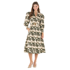 A woman modeling a long-sleeve midi dress with a green and beige tree print, featuring a belted waist and collar, set against a plain white background.