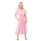 Woman wearing a pink gingham dress on a white background