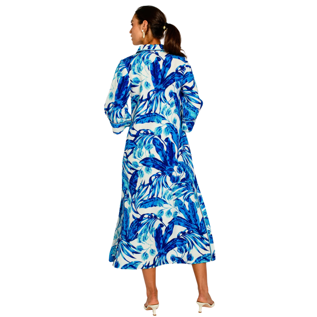 Woman wearing a blue and white floral dress on a white background