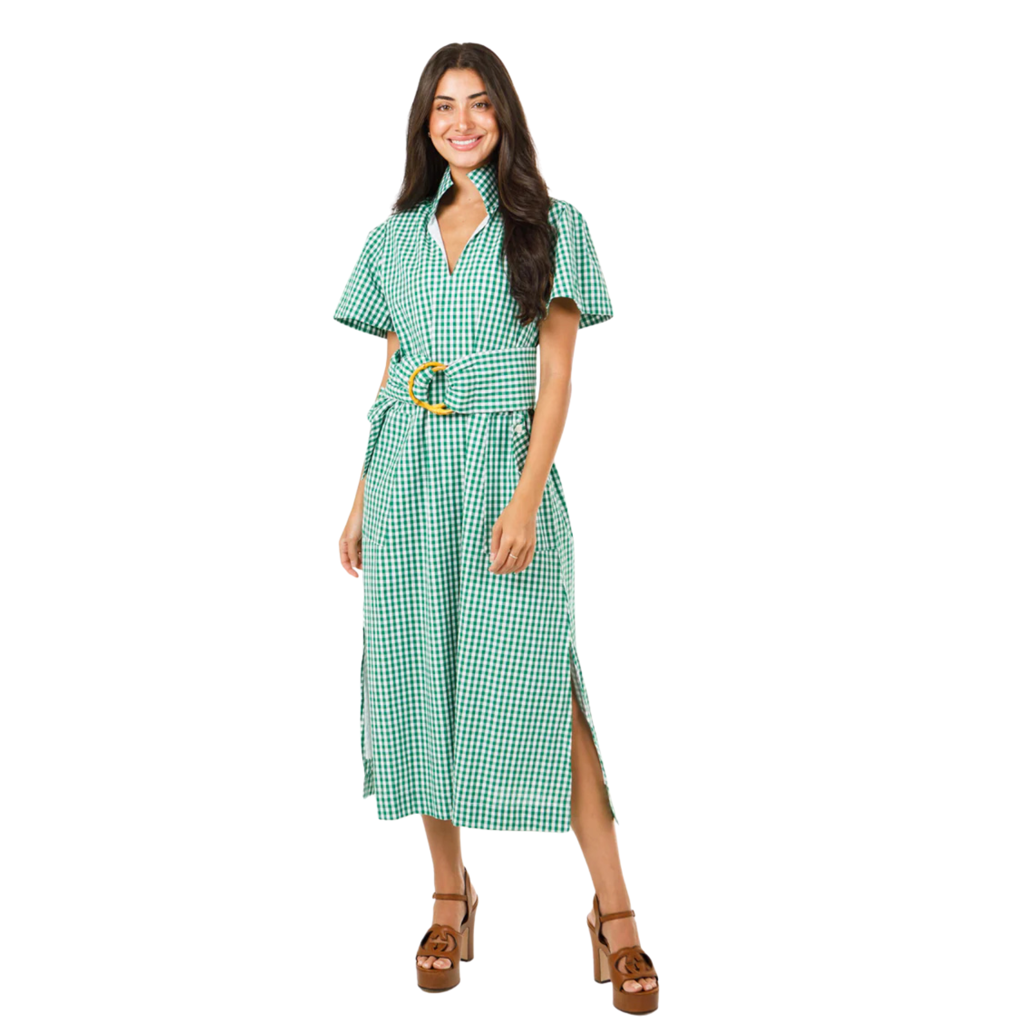 Woman wearing a green checkered dress on a white background