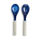 Set of two blue marbled spoons with white bead handles on a white background