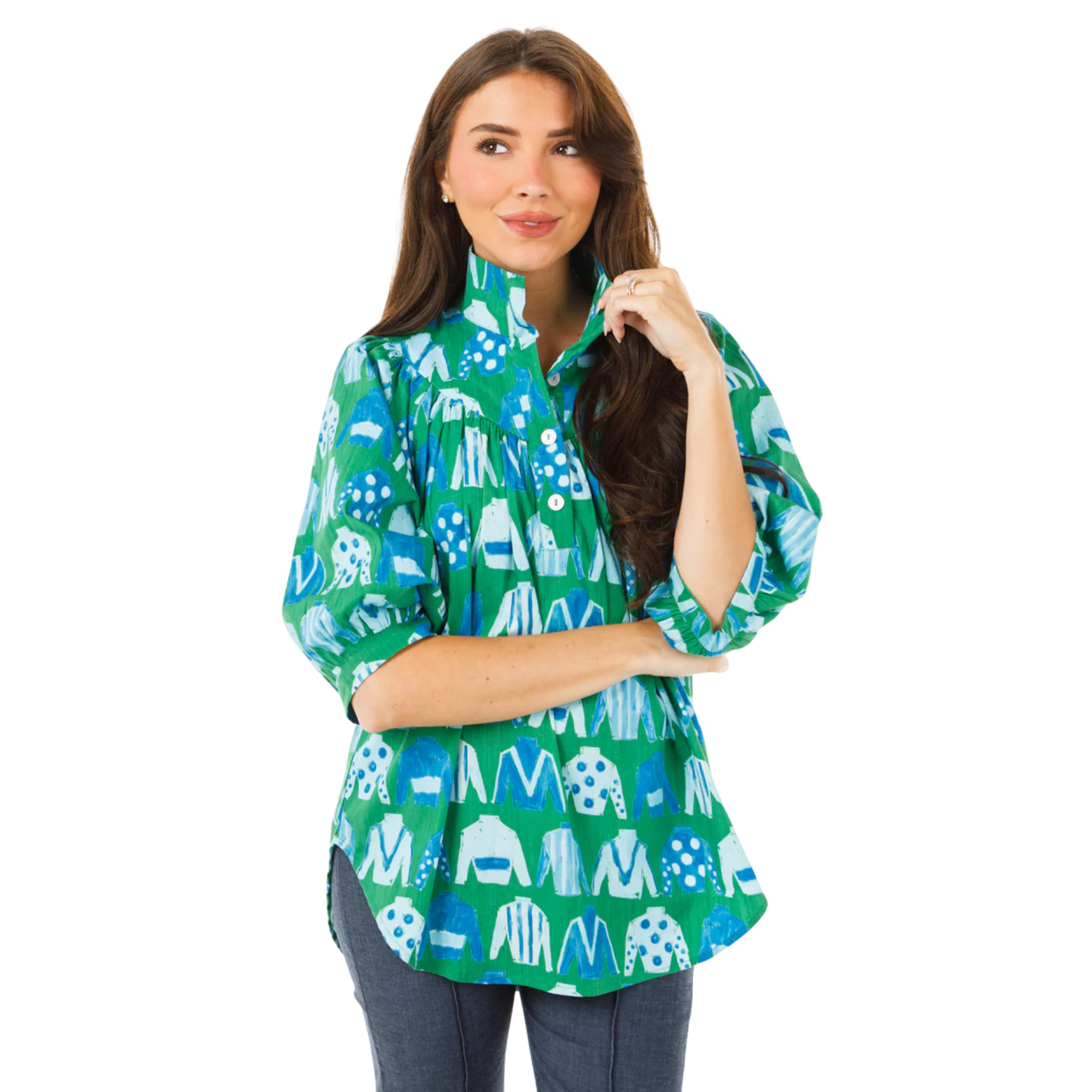Woman wearing a green and blue patterned shirt on a white background