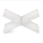 A modern, minimalist X-shaped acrylic or glass tabletop lamp shade on a solid white background.