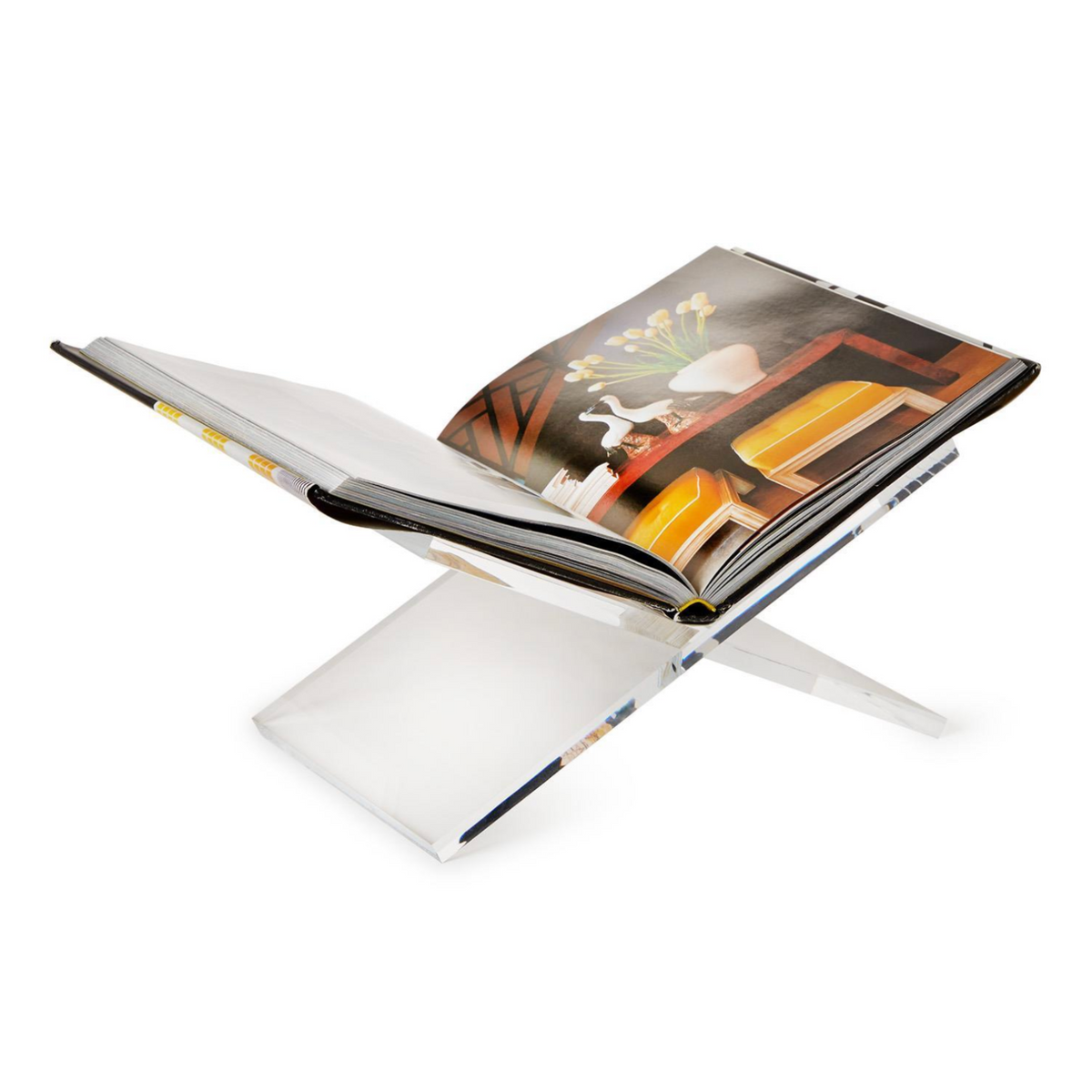 A clear acrylic book stand holding an open magazine or book on a clean white background.