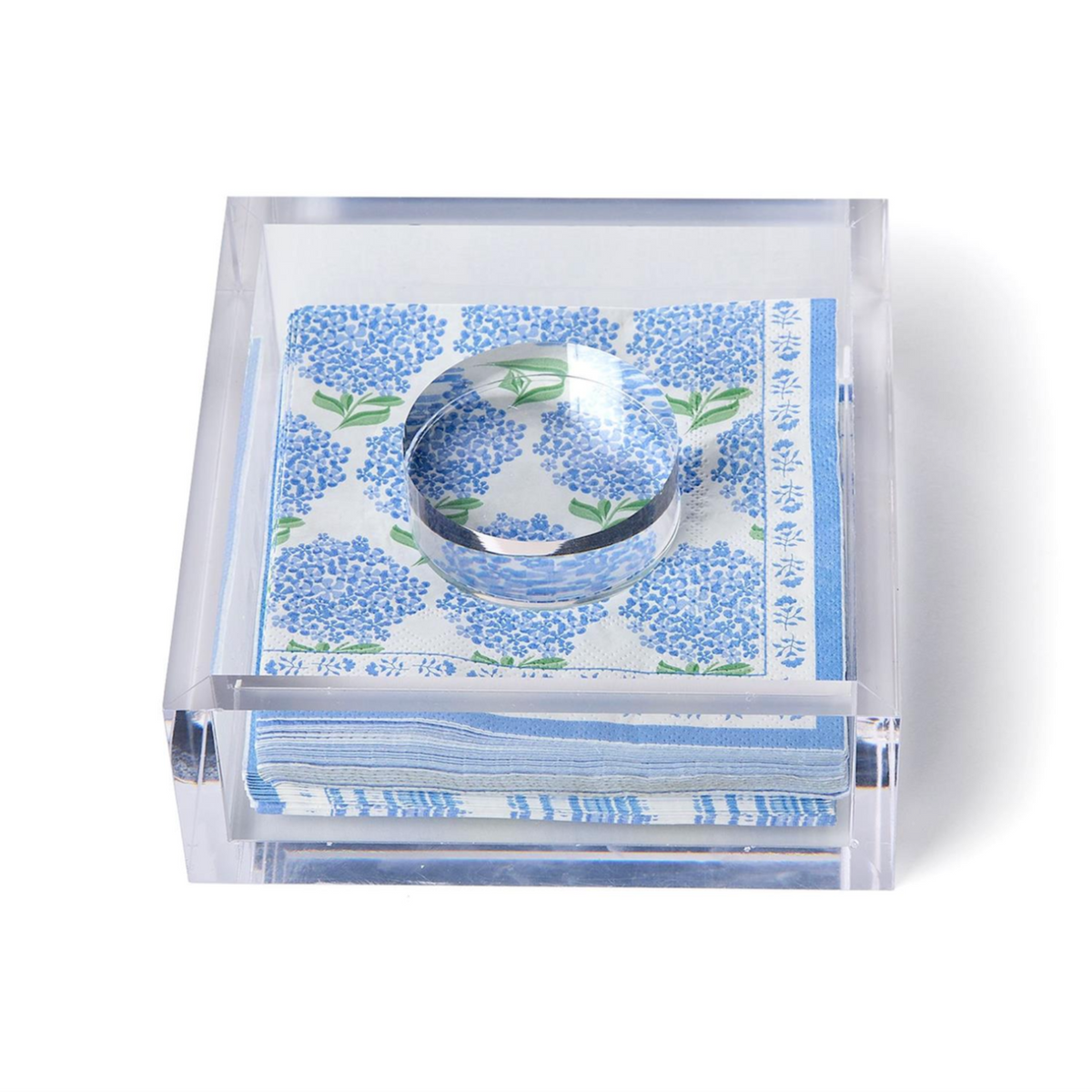 Clear acrylic tray with blue floral patterned napkins on a white background