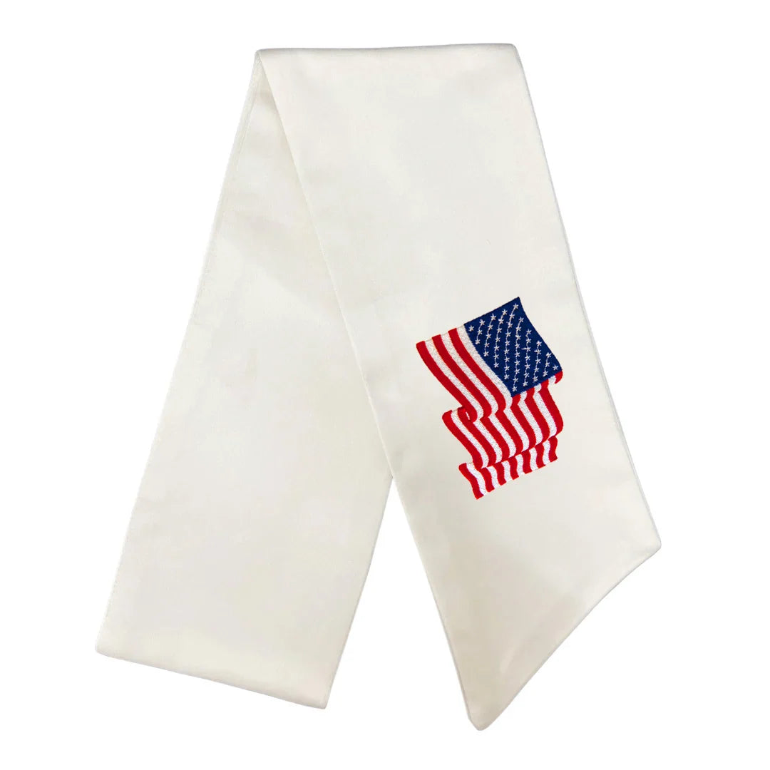 White scarf with an embroidered American flag on a white background
