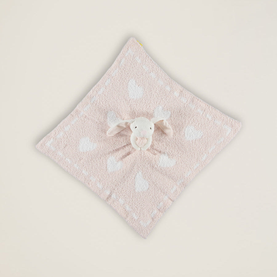 Pink towel with a cartoon character on a light beige background