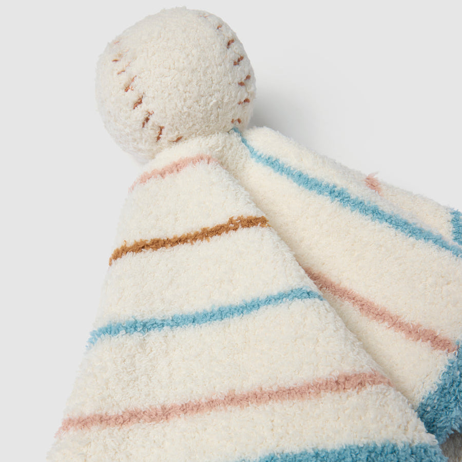 Striped baby comfort blanket with pom-pom on a white background