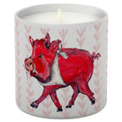 Candle in a container with a red boar design on a white background