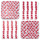 Four square coasters arranged in a 2x2 grid on a white background. Each coaster has a white base with a red and black pattern: two show vertical red leaf-like stripes, and two show a red X pattern with black dots around the edges.