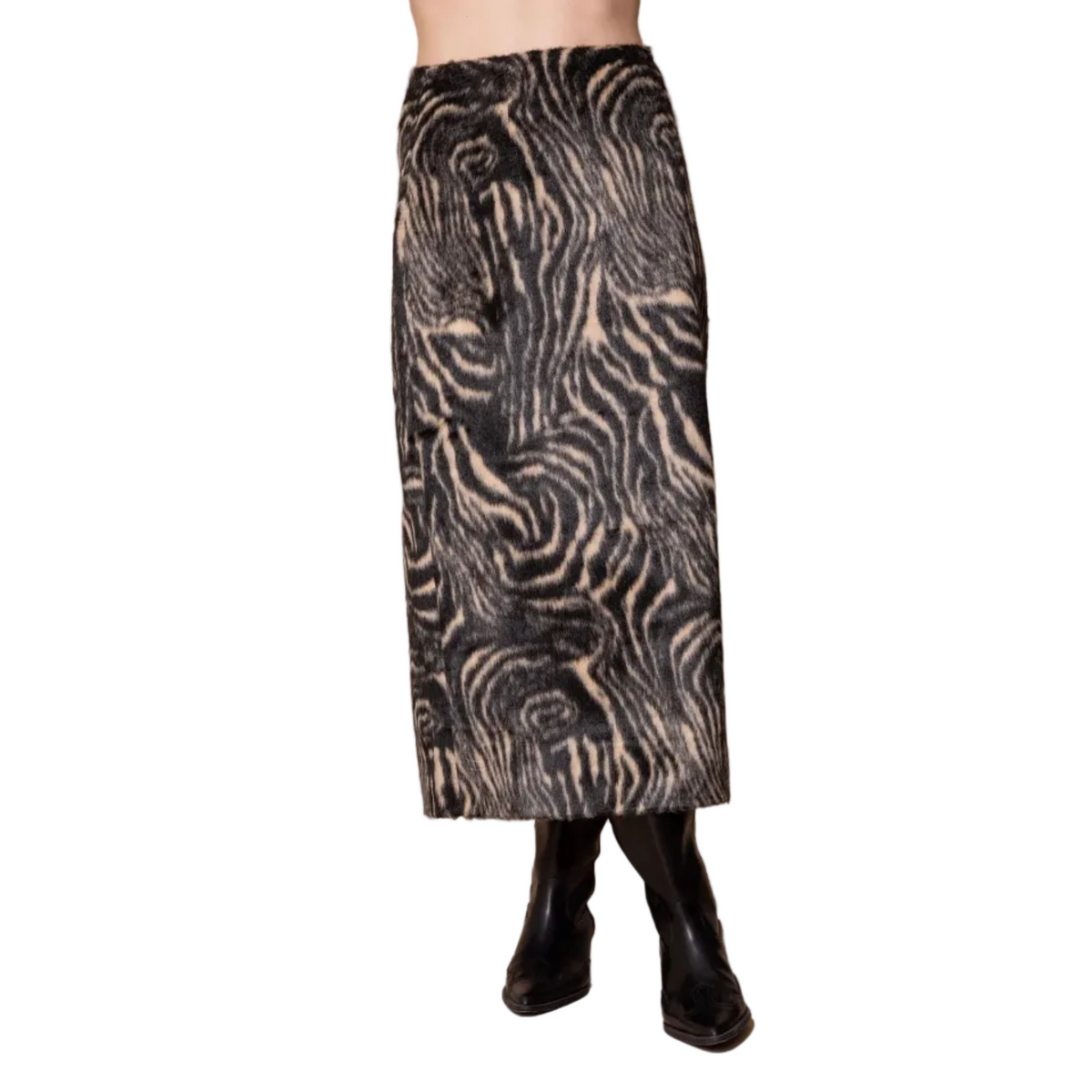 A black and beige zebra-patterned midi skirt shown on a model from the waist down, paired with black boots against a solid beige studio background.