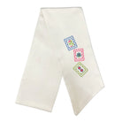 An off-white satin or silk baby baptismal or christening veil with three colorful embroidered monogram squares on the right side, displayed on a clean white background.
