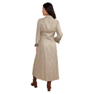 A woman is shown from the back wearing a long-sleeve, collared midi shirt dress with thin vertical stripes, paired with brown boots, against a solid beige studio background.