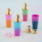 Colorful cocktail shakers and glasses with gradient designs on a light background