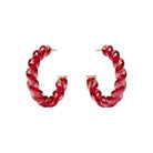 Red hoop earrings on a white background