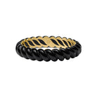 A twisted black and gold bangle bracelet on a clean white background.