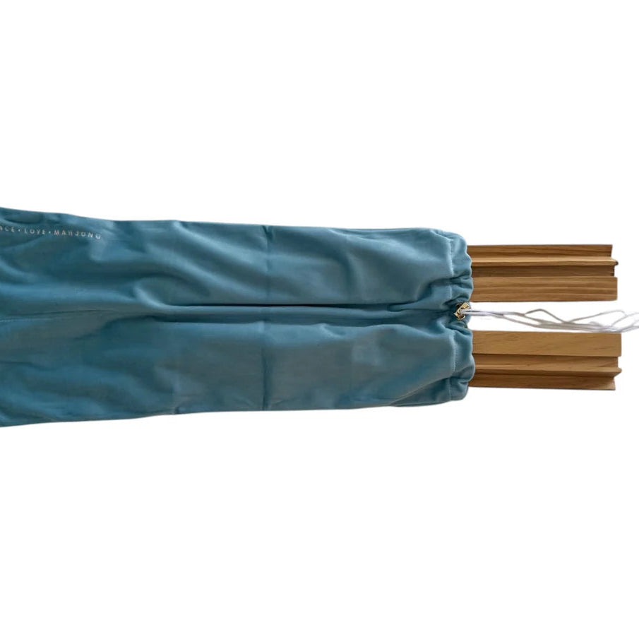 A teal blue drawstring storage bag containing multiple light brown wooden poles, shown against a plain white background.