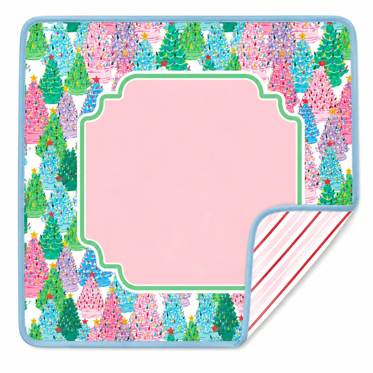 A square pink gift tag or label with a decorative scalloped center and a colorful Christmas tree border print. One corner is folded over to show a striped backing with red and white stripes and a blue edge.