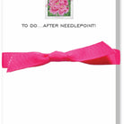 Bright pink bow with a small inset of pink flowers on a white background.