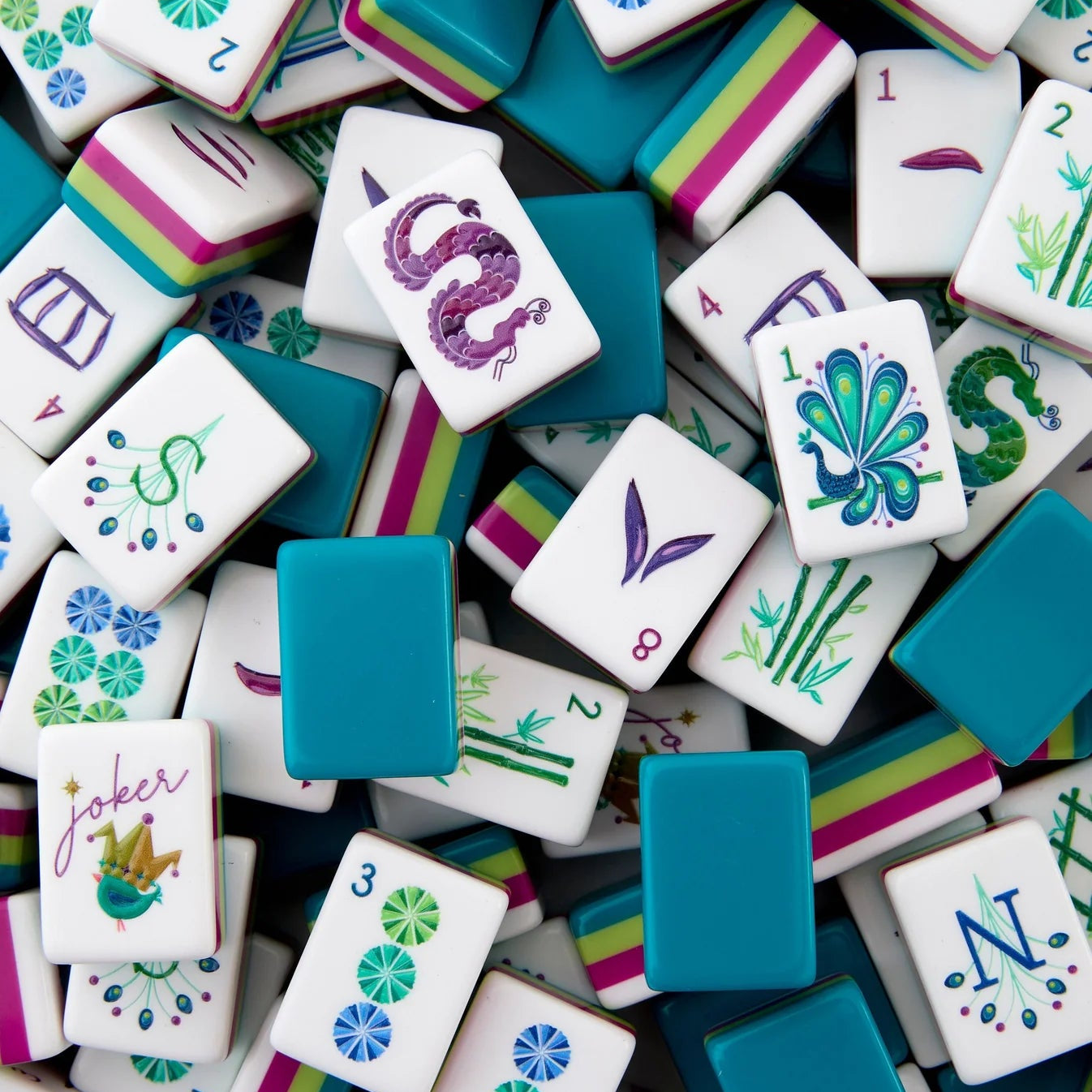 Colorful game tiles with various designs and numbers on a white background