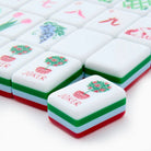Close-up of colorful麻将 tiles with 'Joker' and floral designs on a white background