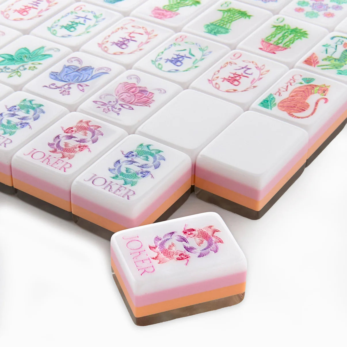 Decorative chocolate candies with colorful designs on a white background